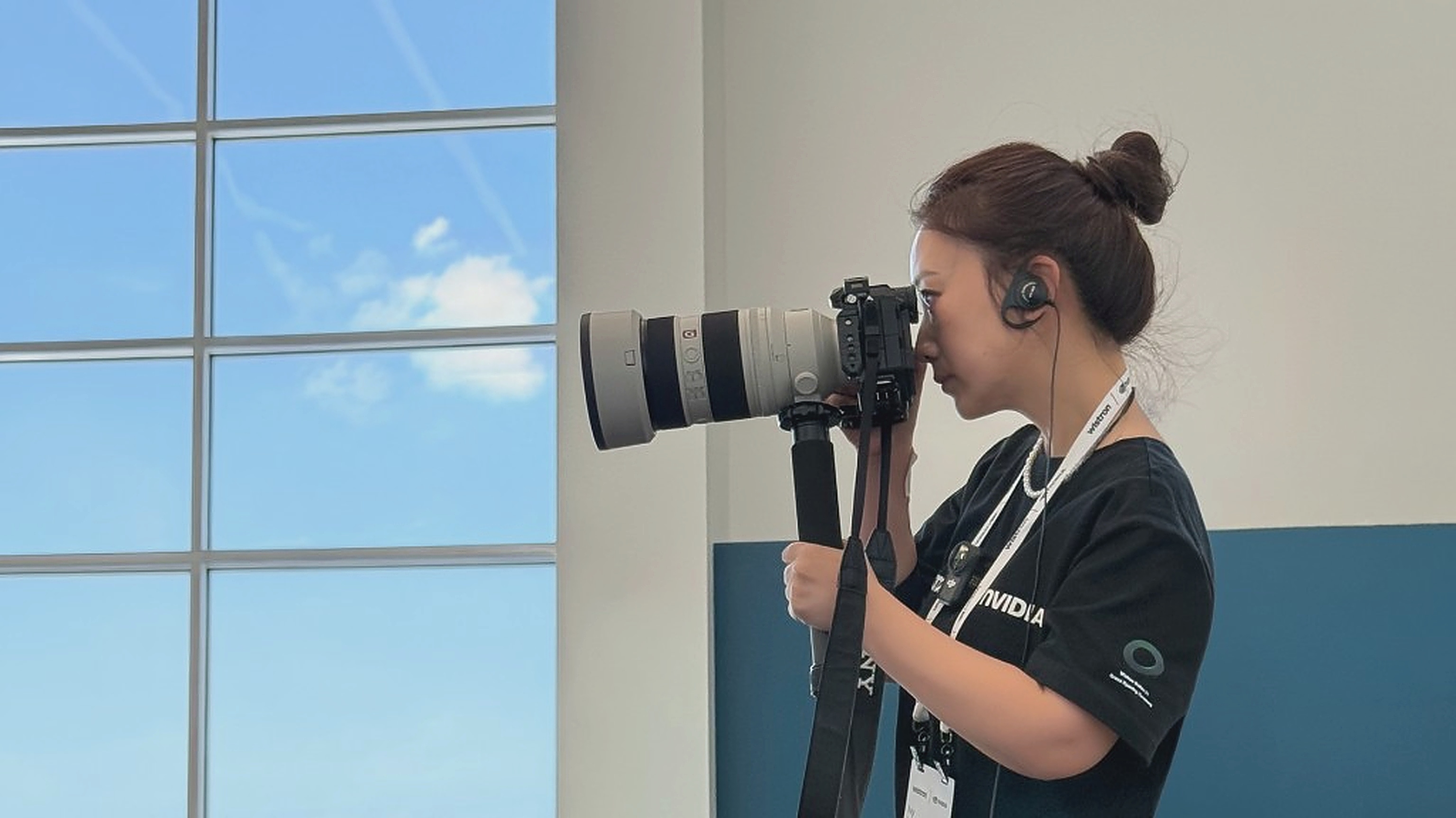 Ivy Ma photographing a corporate event