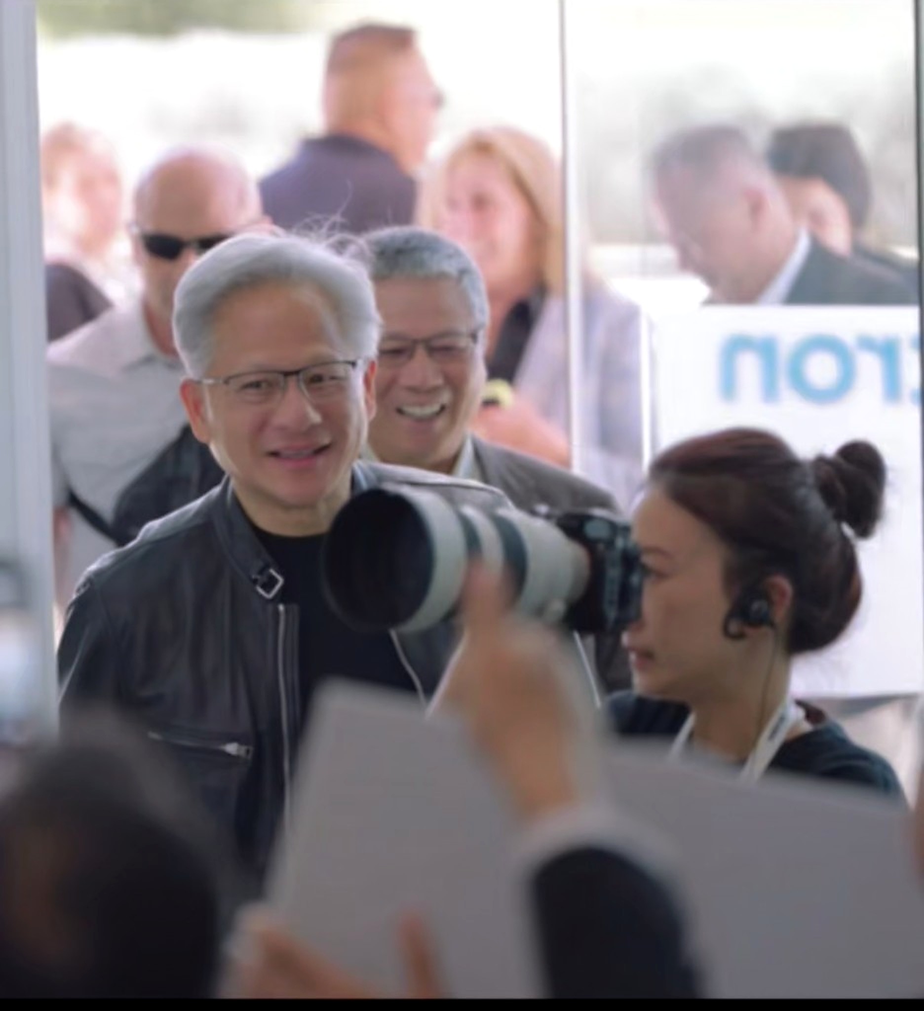 Photographer covering a high-profile client arrival at a corporate event